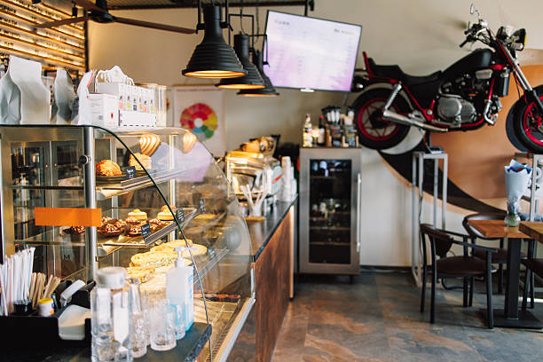istock Modern Coffee Shop Interior with Wall-Mounted Motorcycle 2209401970