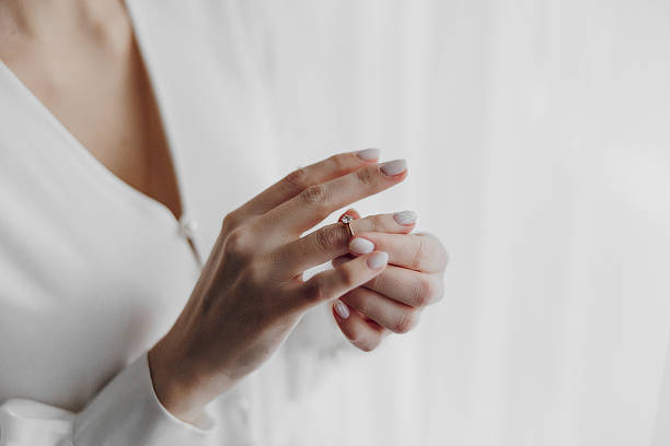 istock A woman is holding a ring in her hand 2209402793