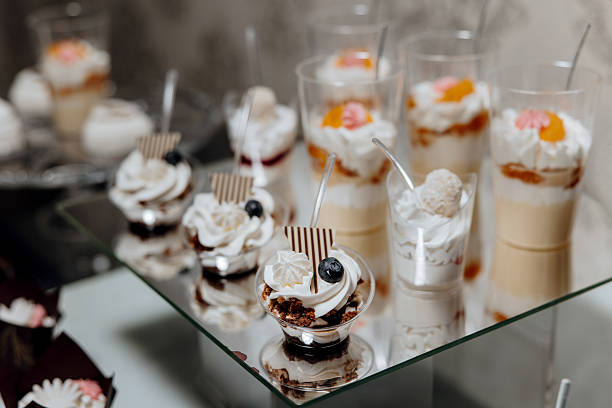 istock A table with a variety of desserts in plastic cups 2209402959