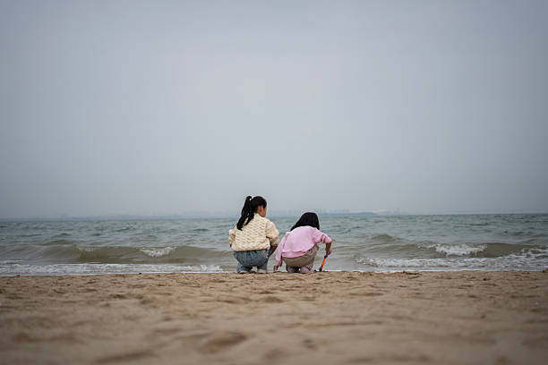 Women enjoying the sea and sand on the beautiful beaches of Sicily, Italy