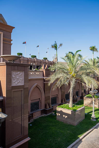 istock Arabesque architecture, arched windows and palm trees, Emirates Palace hotel in Abu Dhabi. UAE 2209406764