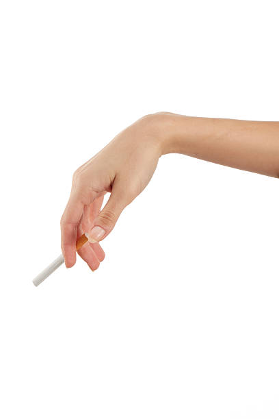 istock Woman hand holding a cigarette 2209407001