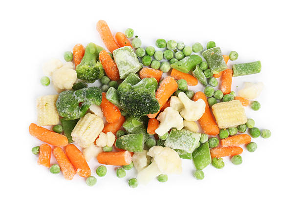 istock Mix of different frozen vegetables isolated on white, top view 2209411104