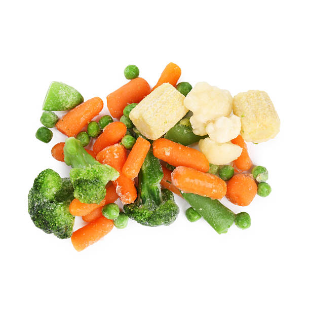 istock Mix of different frozen vegetables isolated on white, top view 2209411152