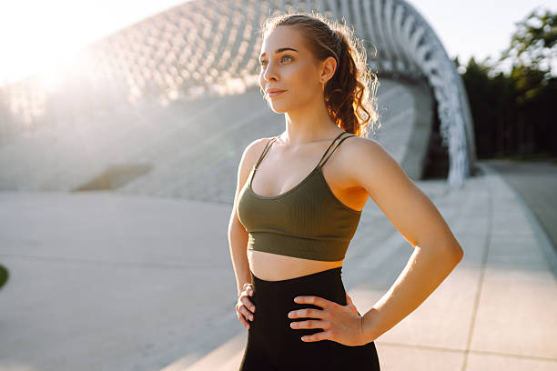 istock Sporty woman doing exercises at sunset. 2209411742
