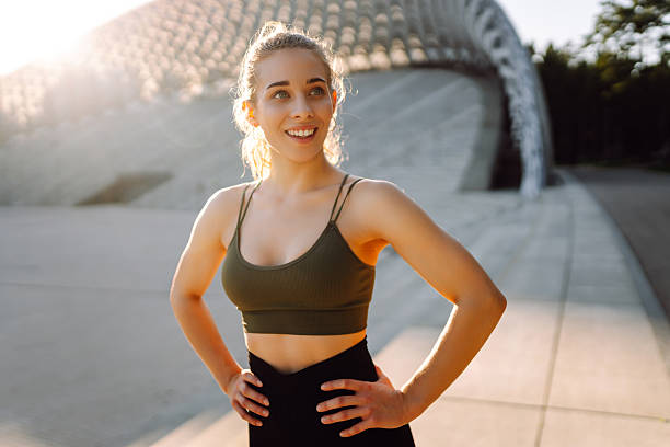 istock Sporty woman doing exercises at sunset. 2209411752