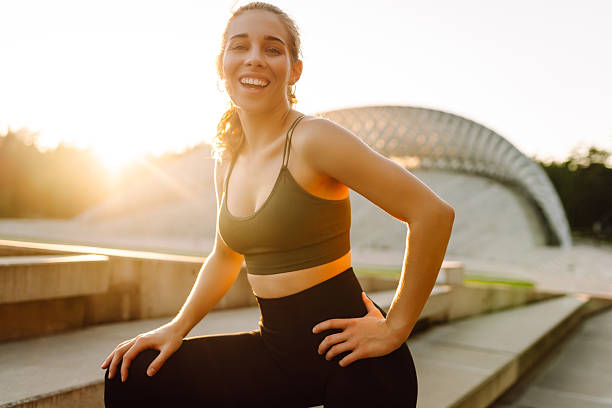 istock Sporty woman doing exercises at sunset. 2209411754
