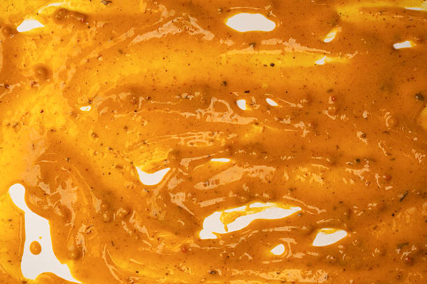 istock Yellow sauce splashes as a background. 2209412861