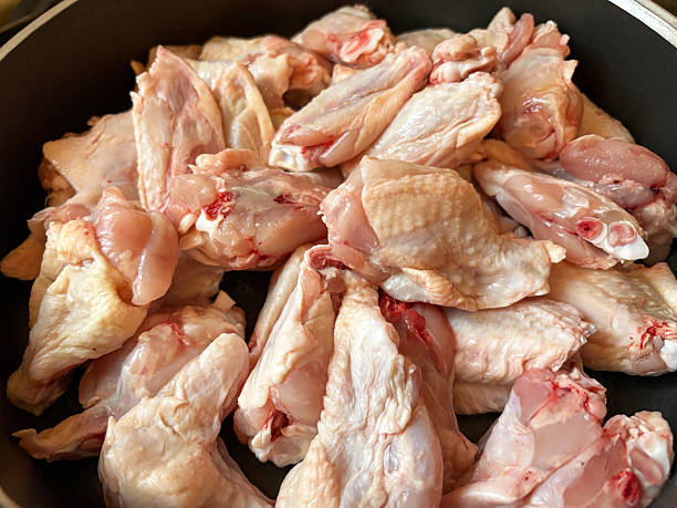 istock Chicken wings in frying pan 2209414676
