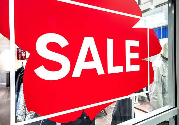 istock Sale sign showcase at a clothes stor 2209415228