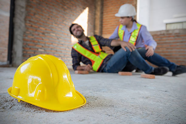 istock Caucasian workers assisting injured colleague in the construction site 2209415278
