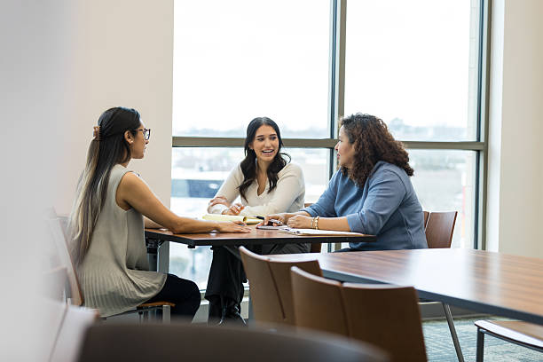 istock Three Diverse Women Collaborating During a Meeting 2209416391