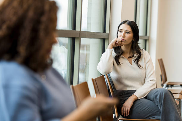 istock Young Woman Contemplating During a Therapy Session 2209416434
