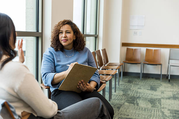 istock Group therapy session:  Mental health professional counseling patient 2209416461