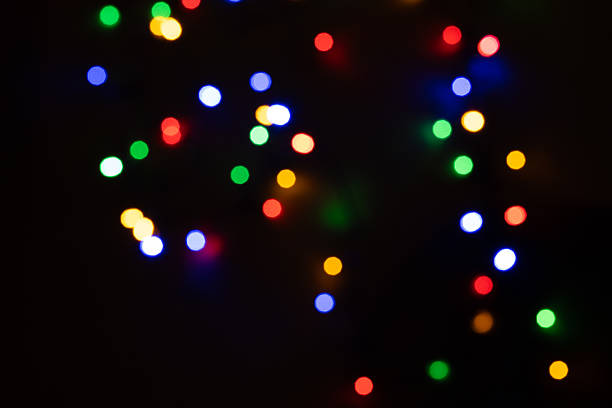 istock String of colorful bokeh lights in darkness 2209417001