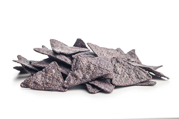 istock Dark nachos chips isolated on white background. 2209417881