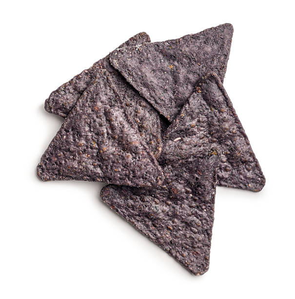 istock Dark nachos chips isolated on white background. 2209417908