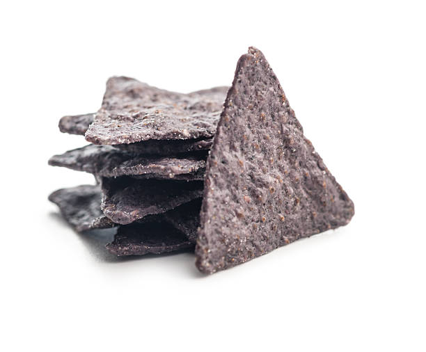 istock Dark nachos chips isolated on white background. 2209417909