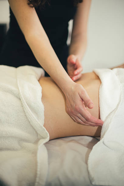 istock Stomach massage stock photo 2209417969
