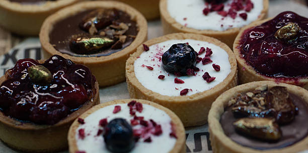 istock Delicious round cakes with fruit filling and berries 2209418370