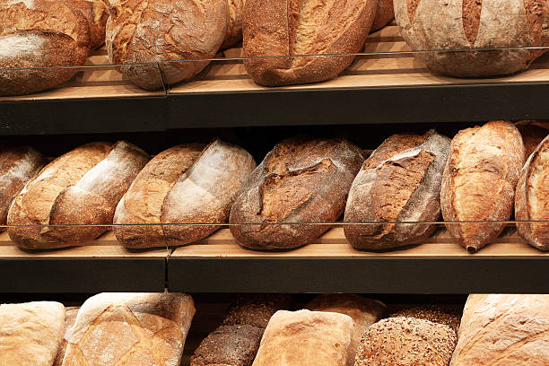 istock shelves with traditional rye and wheat bread 2209418374