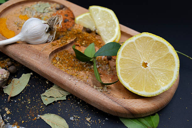 Spices, garlic, lemon seasoning, aromatic on a wooden boar