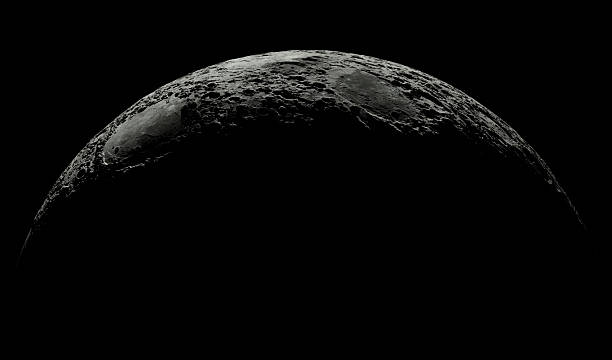 istock High-resolution image capturing the lunar surface at the edge of dawn, with the sun's light casting subtle shadows across the rugged terrain. photograph showcases the moon's craters. Space dark planet 2209425107