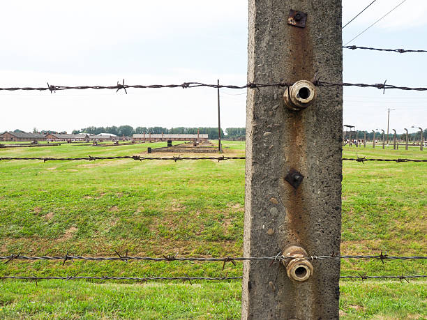 Auschwitz-Birkenau, Poland - July 31, 2017: Separation barbed wire in the prison camps