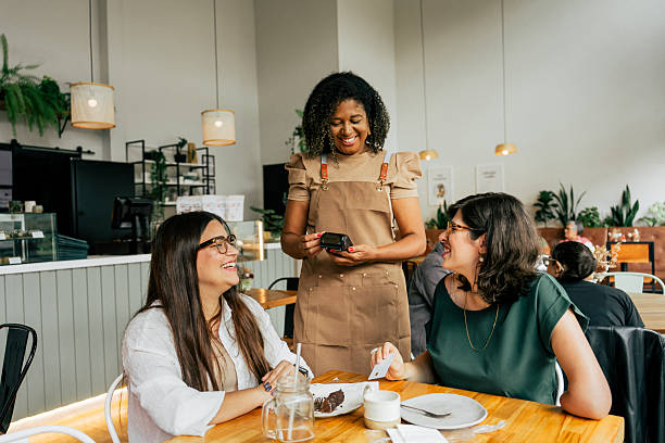 istock Women making contactless payment at coffee shop 2209426338