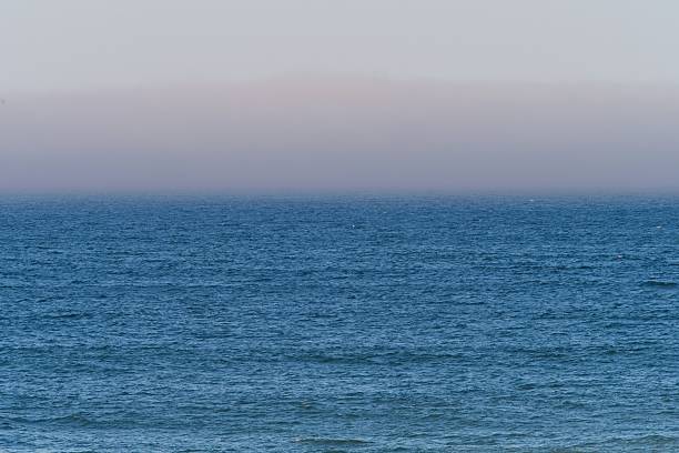 Sea fog just offshore, over Atlantic just of coast of Cape Cod.
