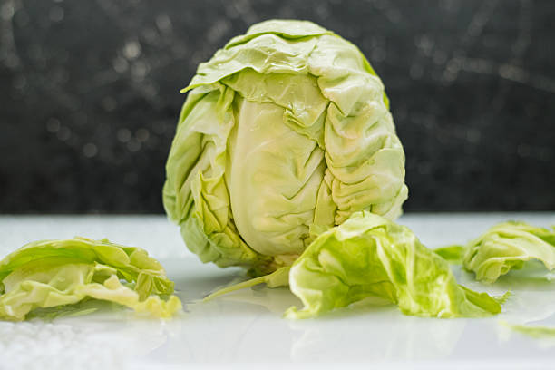 istock A close-up shows a green cabbage under a stream of water 2209427846