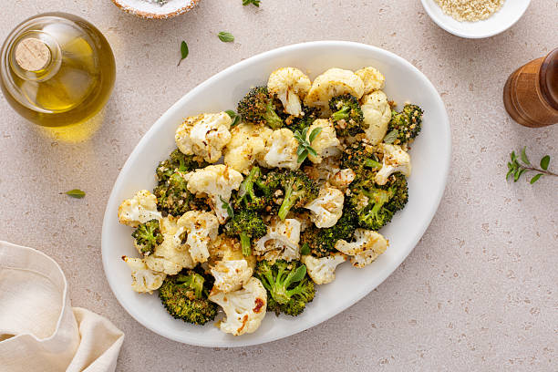 istock Roasted broccoli and cauliflower on a serving plate with herbs and spices 2209429753