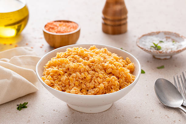 istock Cooked red lentils in a bowl, vegan protein source 2209429758