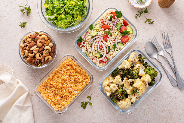 istock Vegan meal prep with lentils, roasted vegetables, nuts and salad 2209429788