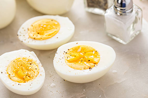 istock Soft boiled eggs cut in half with salt and pepper 2209429794