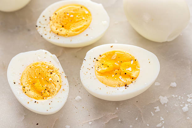 istock Soft boiled eggs cut in half with salt and pepper 2209429801