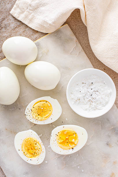 istock Soft boiled eggs cut in half with salt and pepper 2209429806