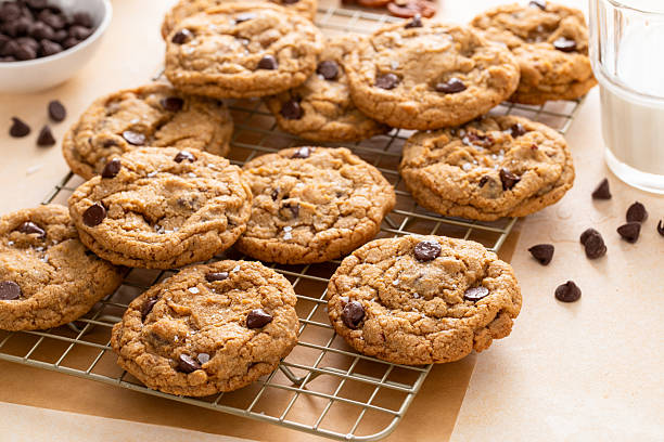 istock Chocolate chip cookies with pecan nuts, freshly baked cookies on a cooling rack 2209429863