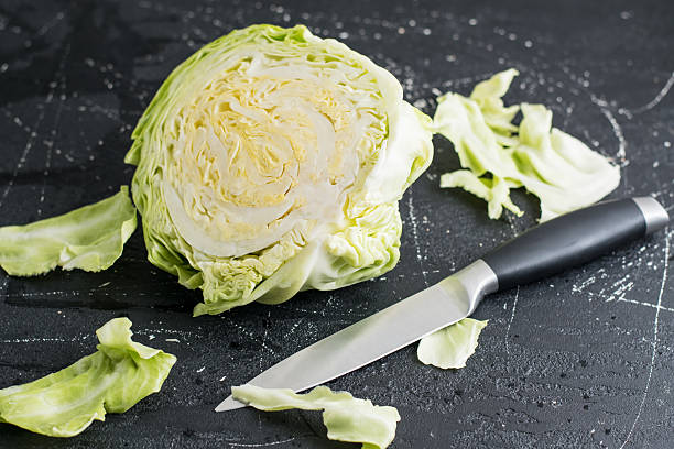 istock The cabbage is cut in half, exposing juicy inner leaves 2209430869