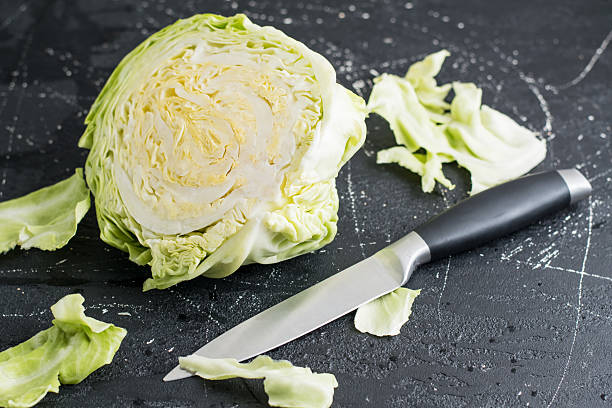 istock The cabbage is cut in half, exposing juicy inner leaves 2209430870