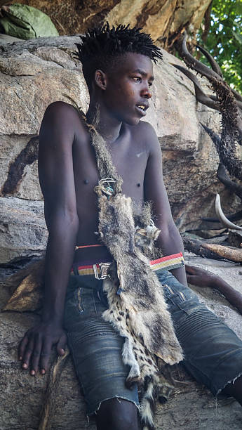 Tanzania, February 25th, A man from Hadzabe tribe seen during morning hunt. The Hadzabe are considered one of the last remaining hunter-gatherer tribes in the world.