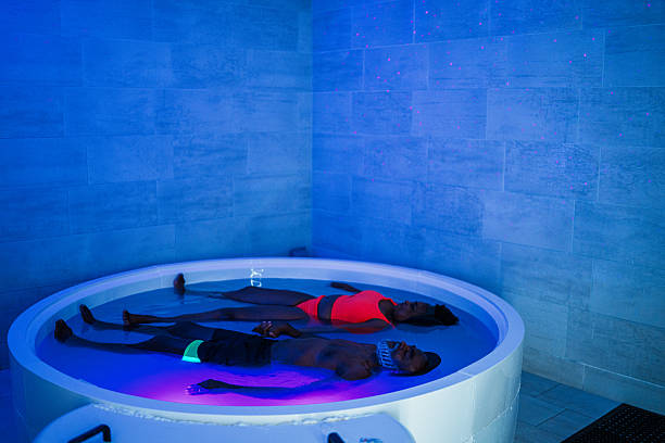 istock Couple in private salt bath float tank at luxury spa 2209443001
