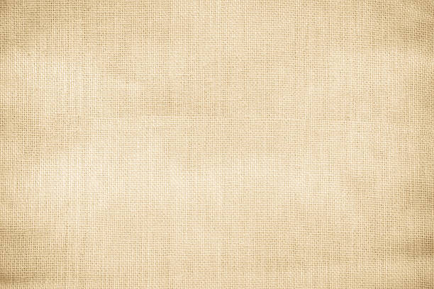 istock Brown sackcloth woven texture background in natural pattern. Jute hessian burlap, linen background in light beige cream color blank. Weaving canvas fiber line cotton cloth textured as organic. 2209443207