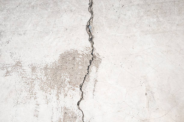 istock Grunge cracked concrete wall texture abstract background 2209443217