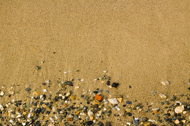 Top view of beach sand with natural stones,summer time,background