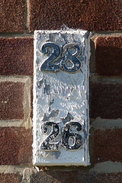 istock Aged House Number Plaque – 28 & 26 2209449561