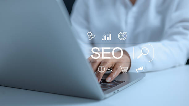 istock Businesswoman using a computer for analysis, SEO search engine optimization marketing Ranking traffic website internet business technology concept, Marketing planning, Data Search Technology. 2209454453