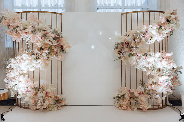 istock A large white wall with a floral arrangement on it 2209456894