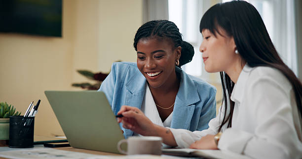 istock Business women, laptop and help in office for feedback, advice or problem solving. Accountant team, collaboration or tech in agency for training, discussion and assistance with learning software 2209456963