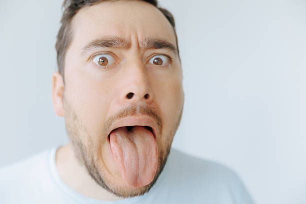 istock Expressive man making a silly face indoors during daytime 2209457330